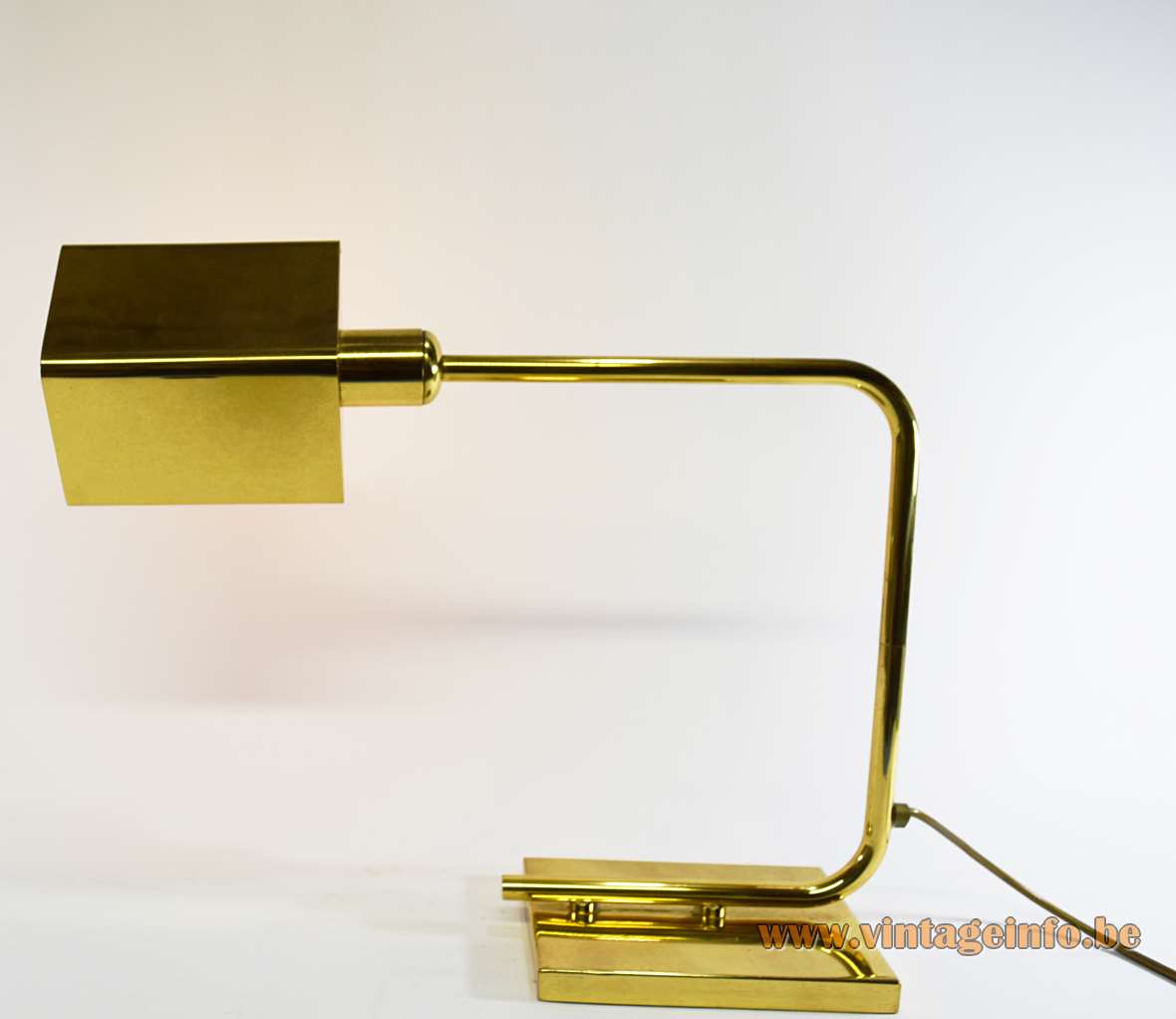 Egoluce brass desk lamp rectangular base curved swing arm rod triangular lampshade 1970s 1980s Italy