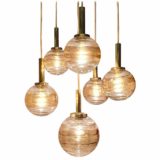 Wortmann globe pendant chandelier with six cascade hanging amber and clear glass lamps 1960s WOFI Leuchten