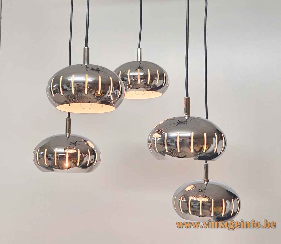 Chrome oval globes pendant chandelier 5 cascading metal lampshades perforated elongated slits 1960s 1970s Massive Belgium